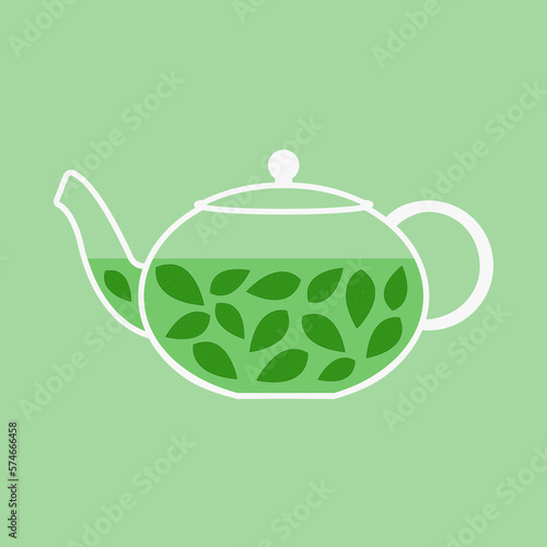 Teapot with green tea and leaves