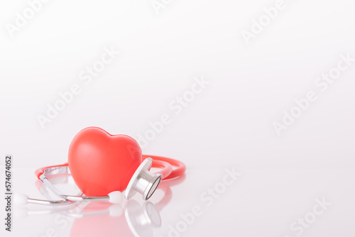 Red heart with doctor physician's stethoscope, World heart health day, doctor day. photo