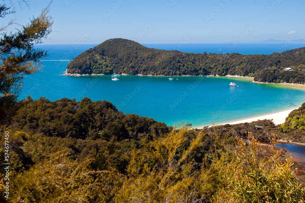 beautiful view of bay with ships in abel tasman national park, southern island new zealand