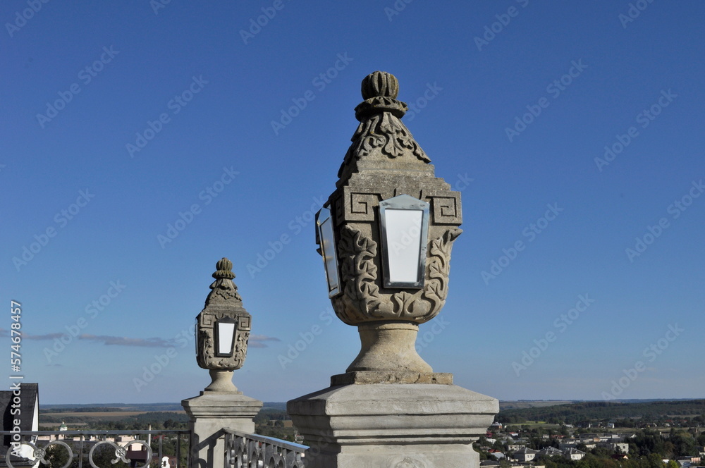 beautiful white stone lantern with art decoration on blue  sky background