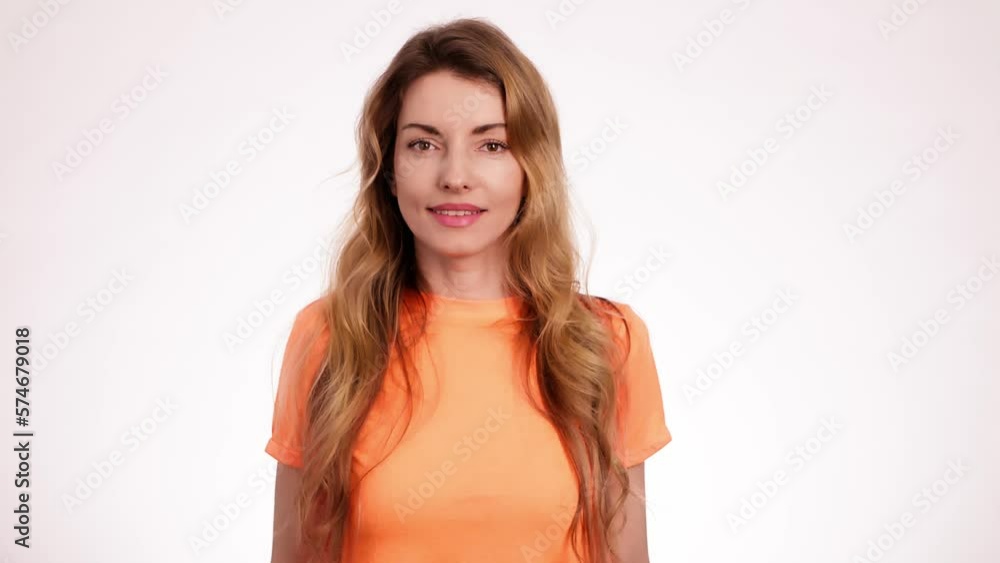 Woman gesturing nodding no, stop, expressing disagreement. Body language concept. Blonde serious girl showing no way ignore, way prohibited in studio isolated on white background. Woman gesturing nodding no, stop, expressing disagreement. Body language concept. Blonde serious girl showing no way ignore, way prohibited in studio isolated on white background.