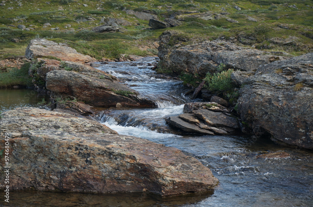Stream among rocks in Swedish mountains