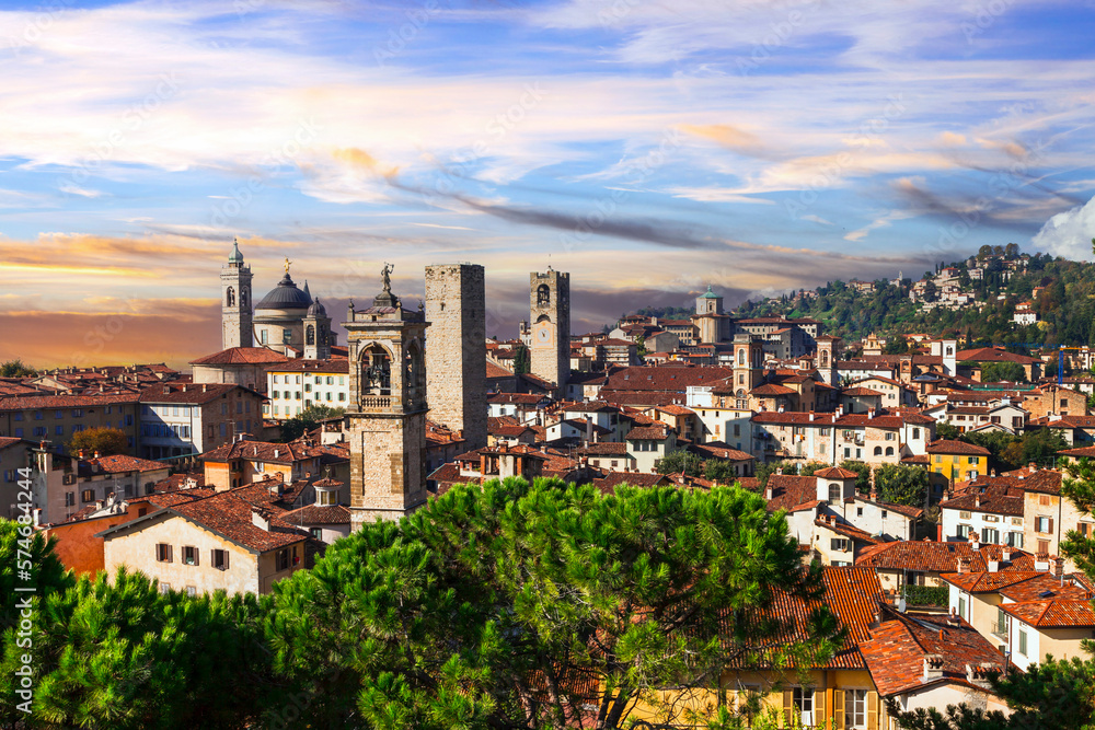 Fototapeta premium Italian historic landmarks and beautiful medieval towns - Bergamo, old town, view with towers over sunset. Lombardia, Italy
