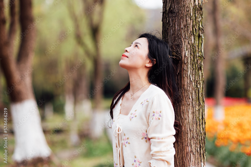 Candid lifestyle Portrait of happy young beautiful asian sexy woman enjoying life outdoor in park at spring. Smiling millennial girl with perfect clear glow skin and long brunette hair Candid lifestyle Portrait of happy young beautiful asian sexy woman enjoying life outdoor in park at spring. Smiling millennial girl with perfect clear glow skin and long brunette hair