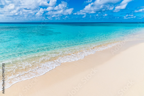A view out to sea along the shoreline on the island of Grand Turk on a bright sunny morning photo