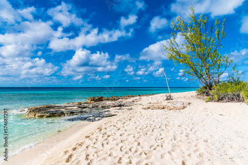 A view along the shoreline towards a rocky headland on the island of Grand Turk on a bright sunny morning