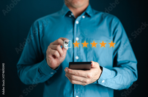 Business Man hand touching on popup five star icon for feedback review satisfaction service, Customer service experience and business satisfaction survey. best quality product and service