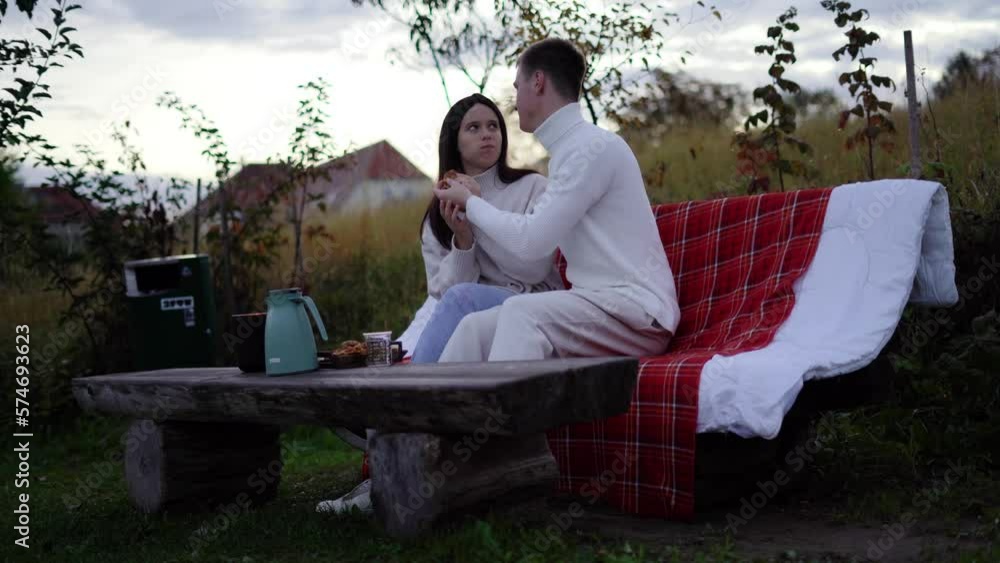 Cute loving couple sit on bench feel care love hugging Cute loving couple sit on bench feel care love hugging