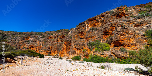 panorama of mandu mandu gorge in cape range national park, western australia; scenic gorge with white stones and red rocks near exmouth