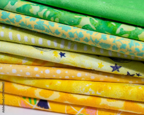 Yellow and Green Fabrics stacked and folded