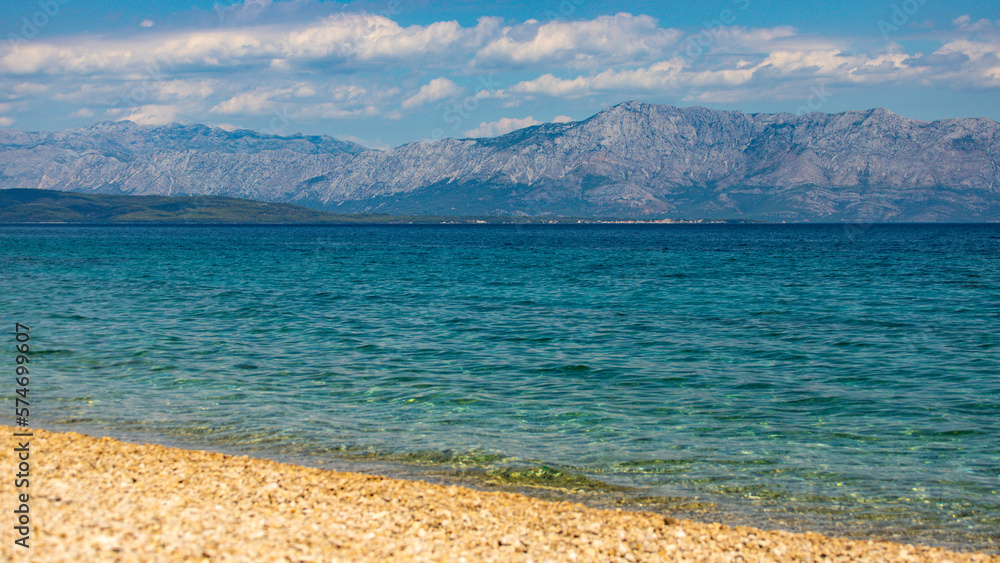 panorama of the peljesac peninsula coastline in croatia; an amazing Mediterranean coastline with rocks and green hills over turquoise water, rocky beach