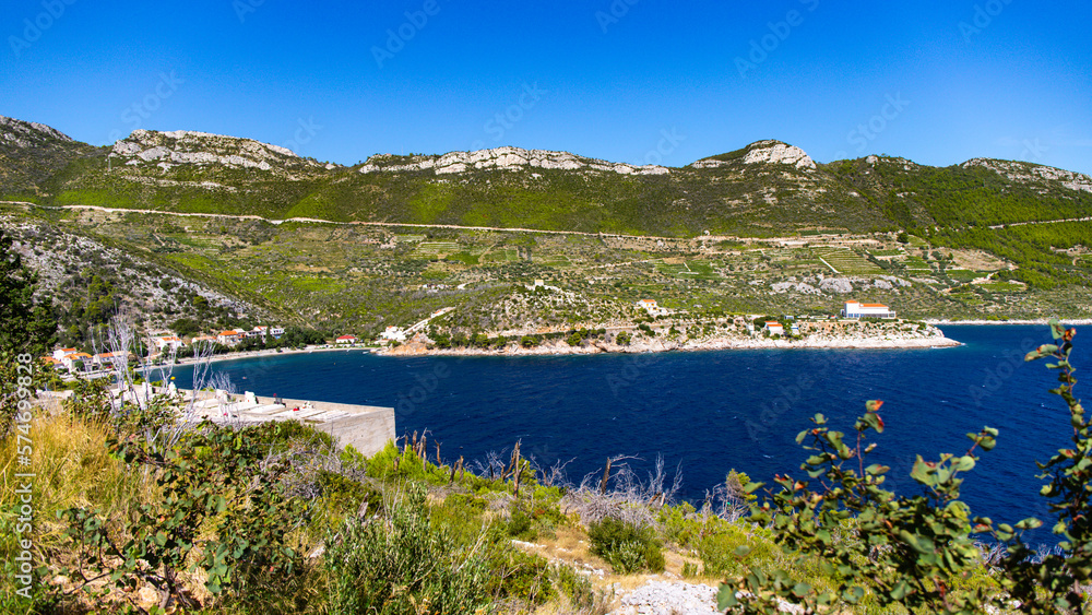panorama of the peljesac peninsula coastline in croatia; an amazing Mediterranean coastline with rocks and green hills over turquoise water
