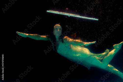Model underwater with flute floating