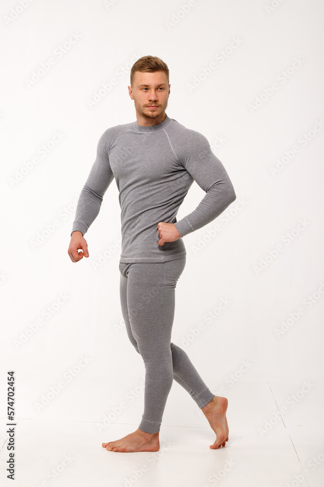 A man with a sporty physique in thermal underwear.