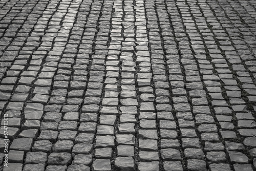 Fotografie Close up image of old cobblestone road surface background texture