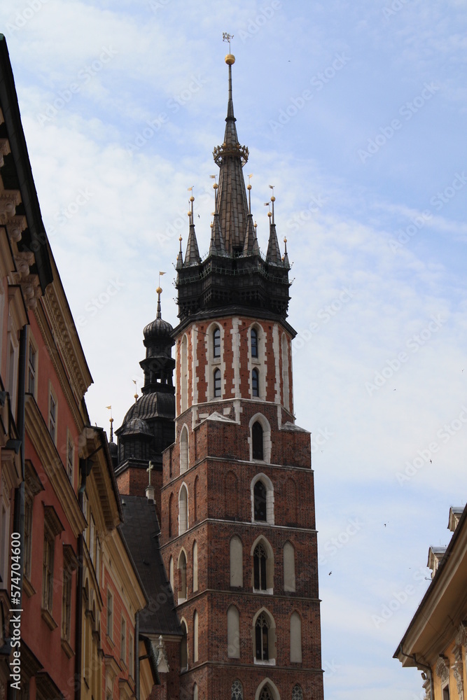 Fototapeta premium Cracow, Poland. Streets and old tenement houses around the old market. Mary's Basilica tower.