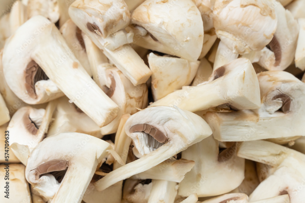Young champignons, cut into plates. Macro, background Young champignons, cut into plates. Macro, background
