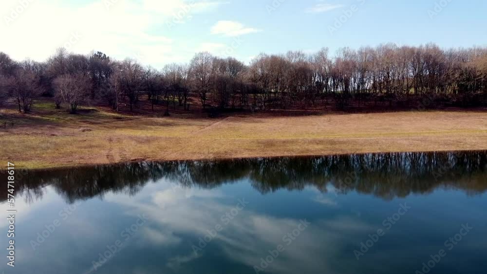 clip drone flying over the edge of a lake filmed the water or a forest clip drone flying over the edge of a lake filmed the water or a forest