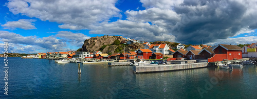 beautiful panoramic view on a swedish typical  town at seaside under cloudy sky