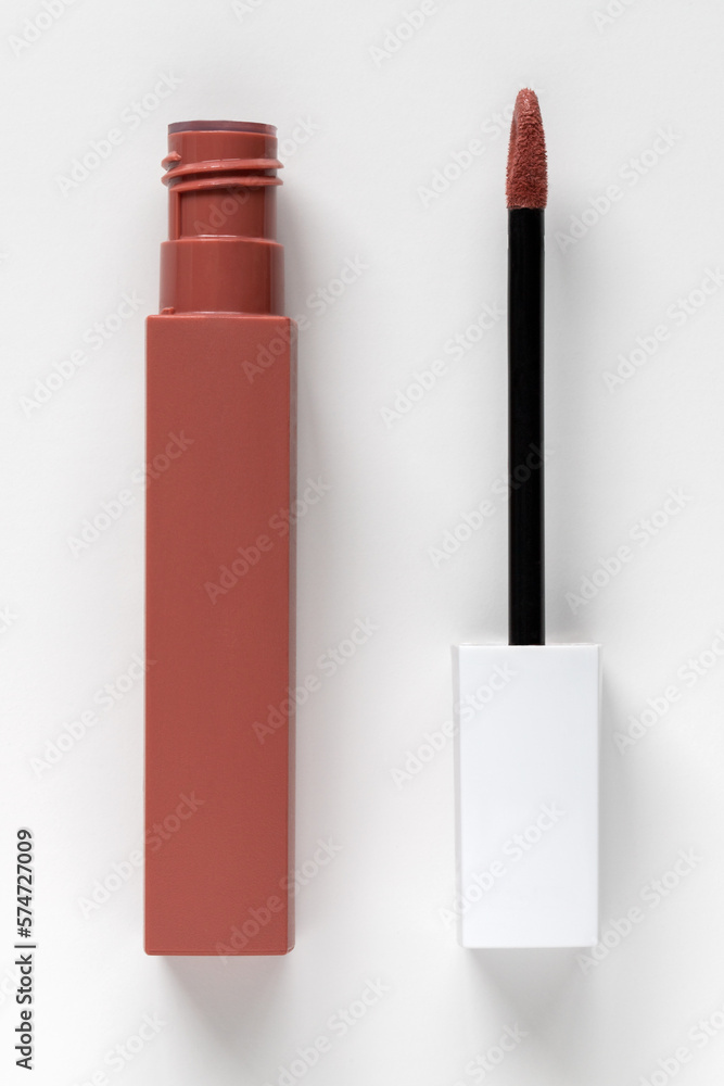 Liquid lipstick open on a white background.