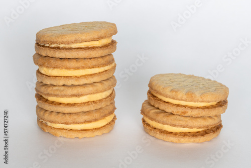 Sandwich cookies with cream on white background.