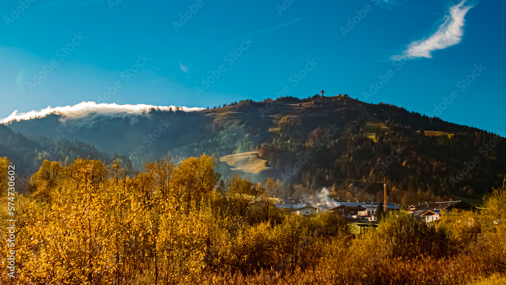Beautiful alpine autumn or indian summer landscape view with the famous Jacob cross seen from near Saint Ulrich, Tyrol, Austria