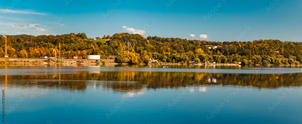 Beautiful autumn or indian summer landscape view with reflections at Mettenufer, Danube, Bavaria, Germany