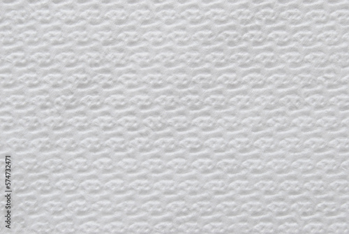 A sheet of white structured white tissue paper as background 