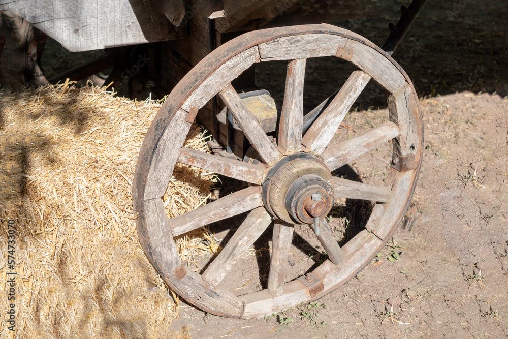 Old Wooden Wheel of Ancient Wagon Close Up
