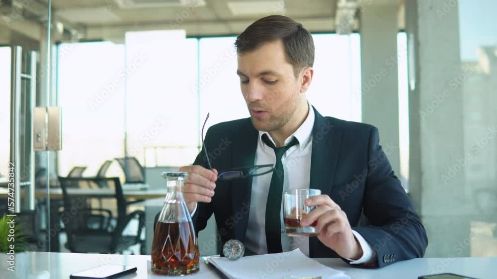 custom made wallpaper toronto digitalThings getting worse, difficulties at job. Frustrated young businessman drinking cause of having stress, holding glass of whiskey, holding his head, office interior