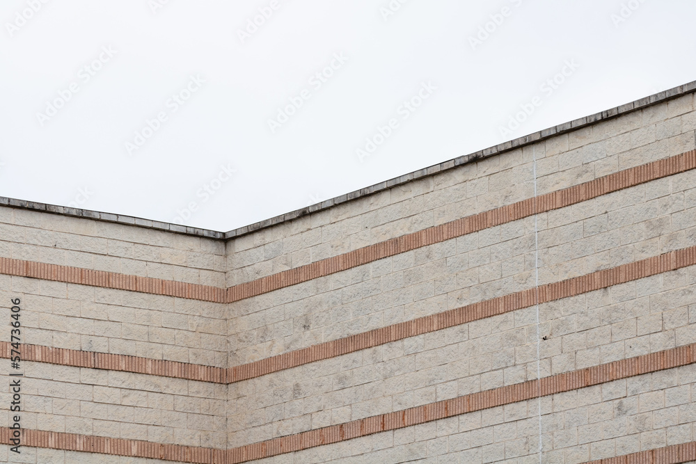 Urban abstract architecture.. close up of a facade with grey sky. Urban abstract architecture.. close up of a facade with grey sky.