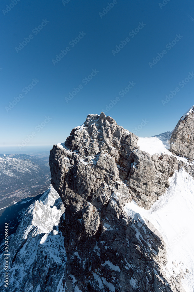 the top of germany aerial view of the snow-covered mountains photographed in winter with bright sunshine and not a single cloud in the sky a place worth seeing in the south of germany
