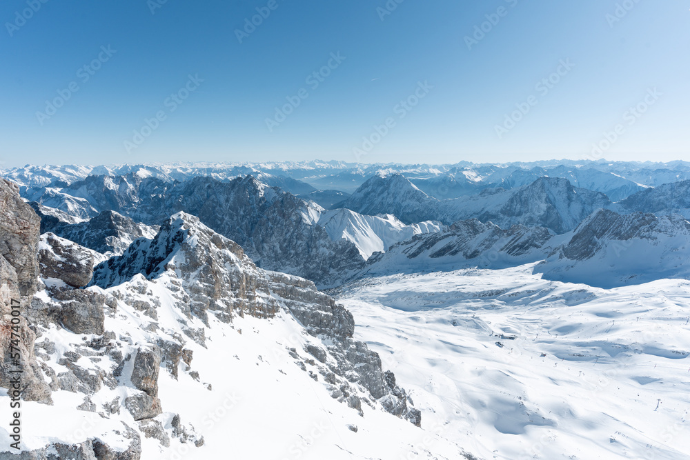 the top of germany aerial view of the snow-covered mountains photographed in winter with bright sunshine and not a single cloud in the sky a place worth seeing in the south of germany