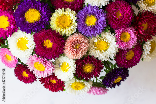 Bouquet of small colorful chrysanthemums. Bouquet in the shape of a basket. Top view