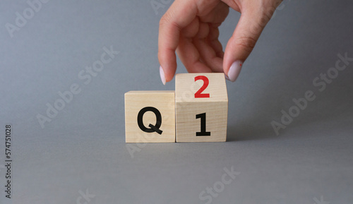 Wallpaper Mural From 1st Quarter to 2nd symbol. Businessman hand Turnes cube and changes words 1st Quarter to 2nd Quarter. Beautiful grey background. Business and Quarter concept. Copy space Torontodigital.ca