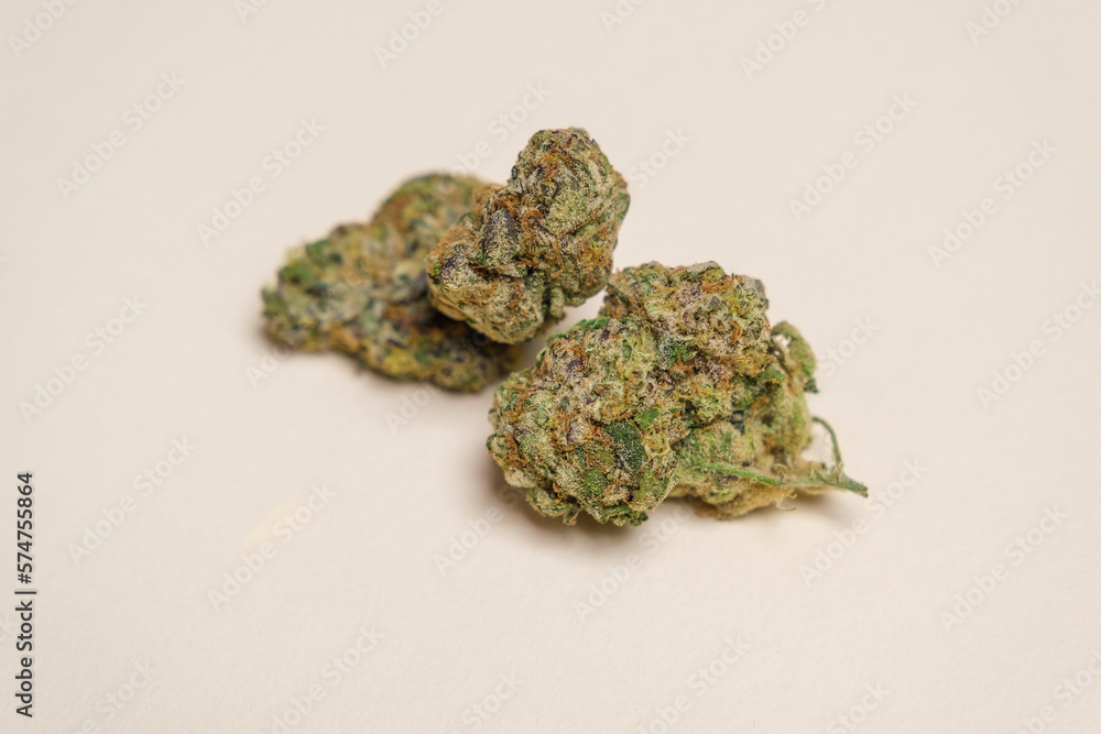 Quality outdoor marijuana, cannabis, weed buds on a white background Quality outdoor marijuana, cannabis, weed buds on a white background