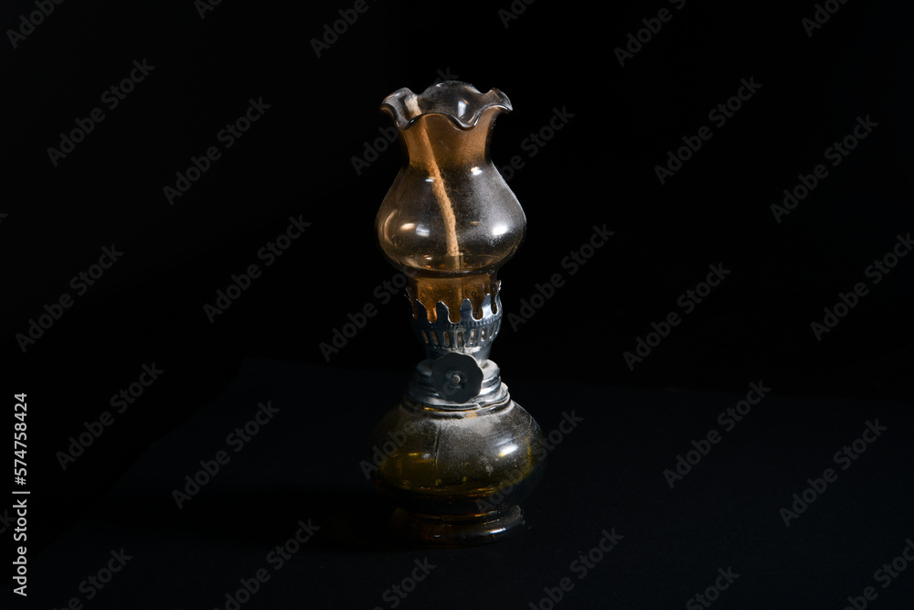 old oil lamp on black background old oil lamp on black background