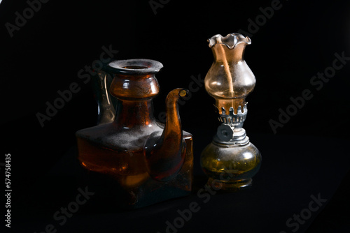 old oil lamp on black background