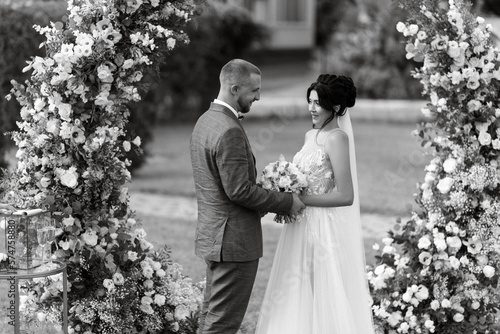 wedding ceremony of the newlyweds on the glade