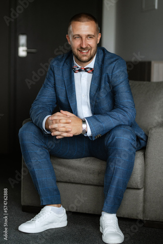 portrait of smiling groom with beard