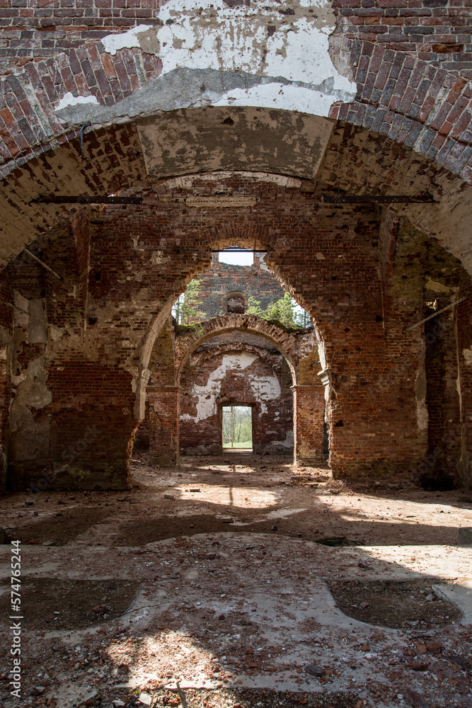 Inside ruin of the orthodox church. Wall of red bricks and crushed view