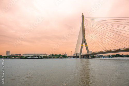 View of Bangkok bridge over the river during sunset time.