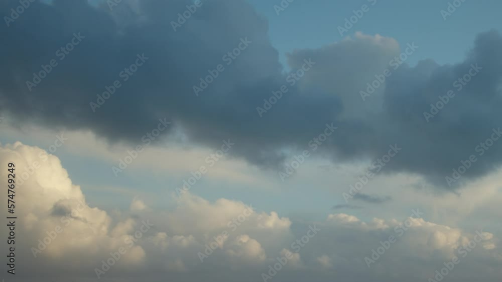 Beautiful cumulus clouds move quickly in the sky at dawn, video timelapse, morning sky as background. Beautiful cumulus clouds move quickly in the sky at dawn, video timelapse, morning sky as background.