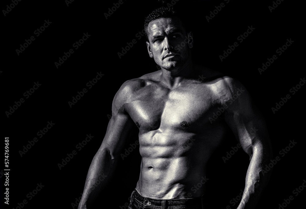 Fototapeta premium Muscular sexy man. Handsome sexual strong man with muscular body. Black and white