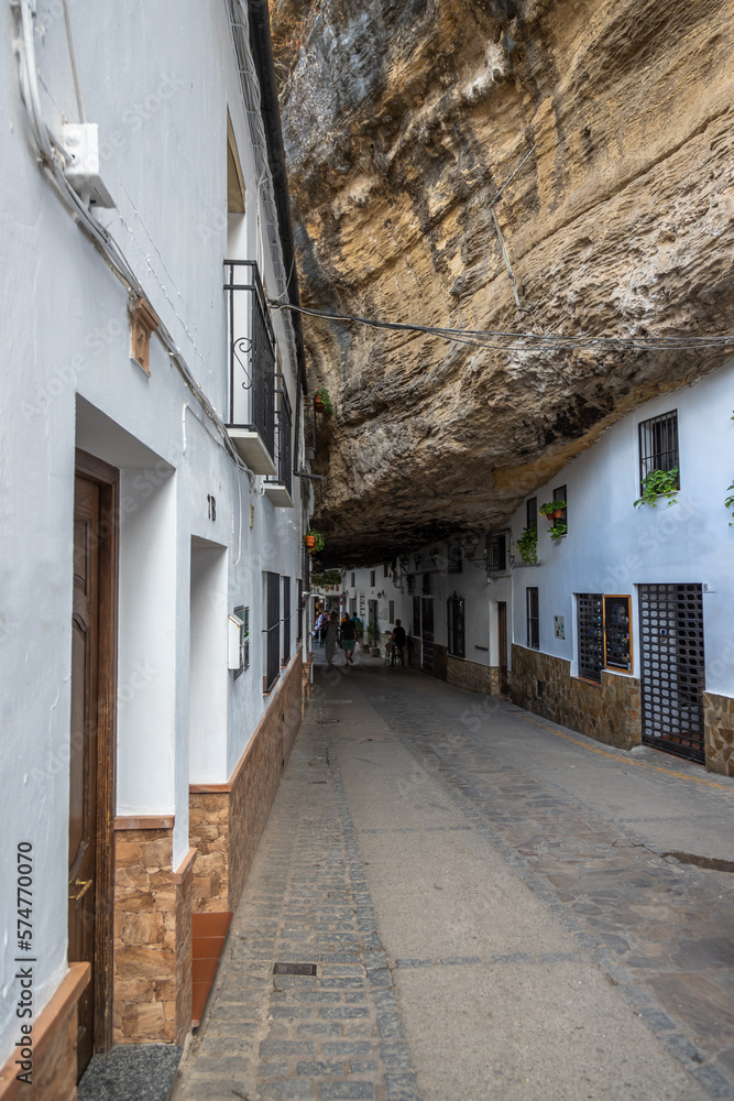 Exposure of Setenil de las Bodegas famous for its dwellings built into rock overhangs above the Río Guadalporcún, Cadiz, Spain