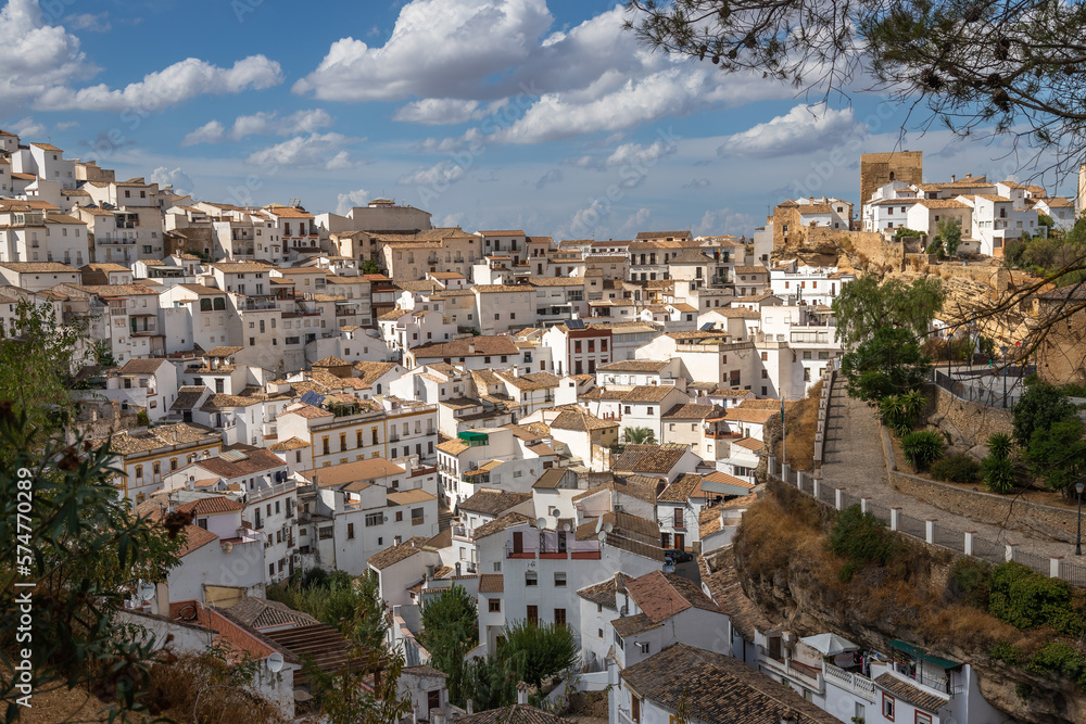 Exposure of Setenil de las Bodegas famous for its dwellings built into rock overhangs above the Río Guadalporcún, Cadiz, Spain