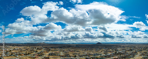 Puffy Clouds Blanket the Desert Cityscape in Ethereal Beauty