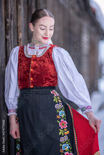 Young beautiful slovak woman in traditional costume. Slovak folklore