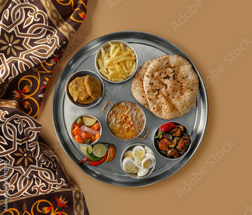 Arabic cuisine, Egyptian Breakfast - Beans; Middle Eastern traditional breakfast. It's also Ramadan food 'Suhur' or 'Shoor', Middle eastern, Arabic traditional breakfast with falafel, foul. photo