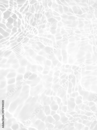 Defocus blurred transparent white colored clear calm water surface texture with splashes and bubbles. Trendy abstract nature background. Water waves in sunlight with copy space. White water shine